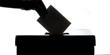 Votes-Weighted Representation: a hand casting a vote