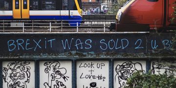 Net zero no: Brexit graffiti on a steel railway bridge