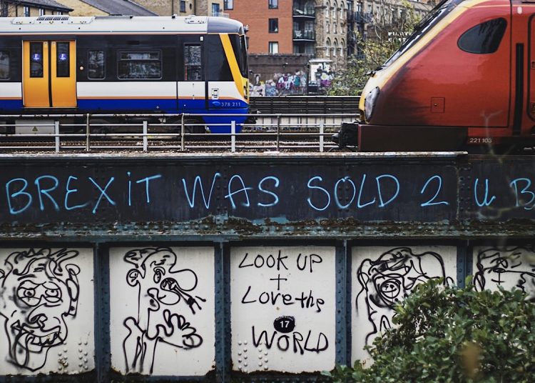 Net zero no: Brexit graffiti on a steel railway bridge